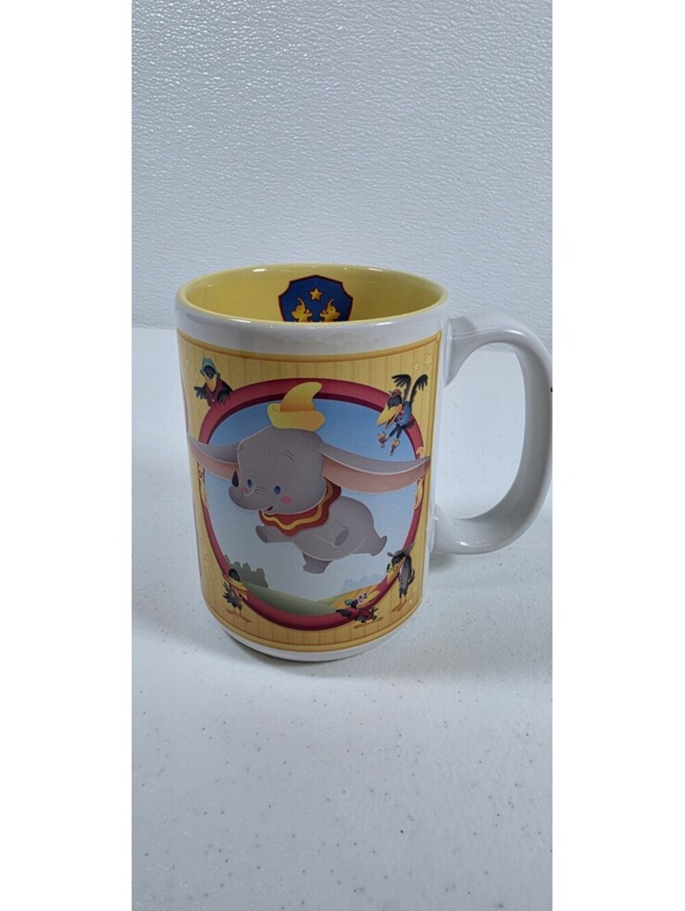 Disney Parks Dumbo the Elephant Mug Cup Yellow Various Scenes Circus Coffee Tea